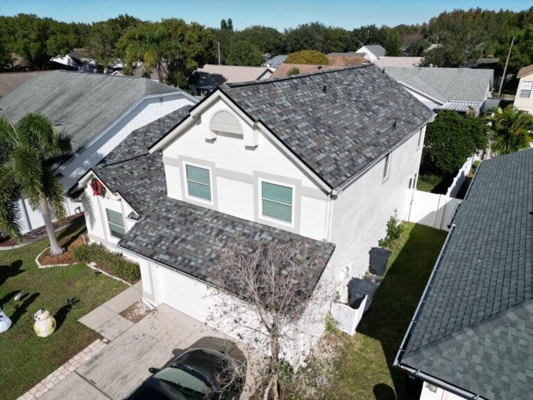 A white house with a new shingle roof