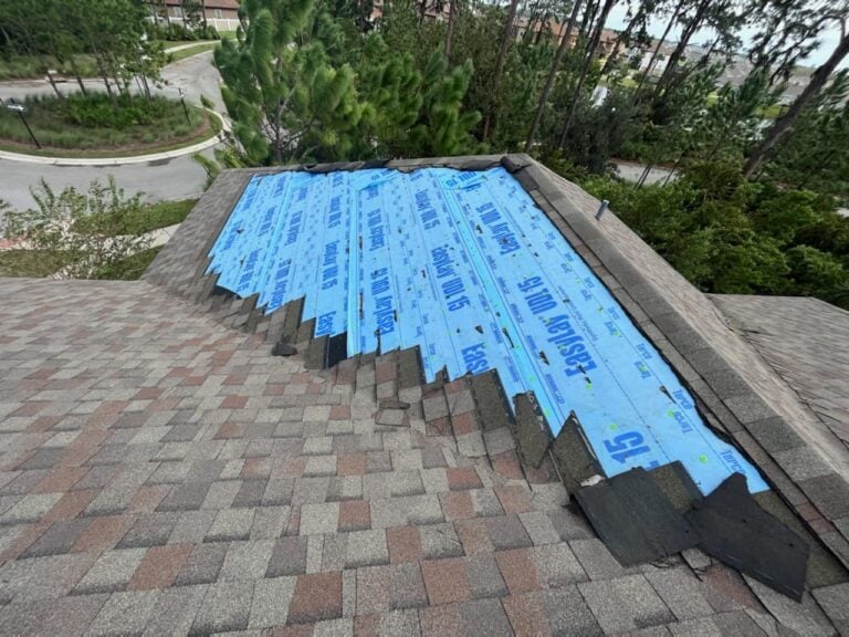 Missing shingles on a roof after storm damage