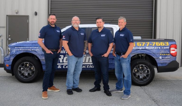 Shingle Masters team in front of company car