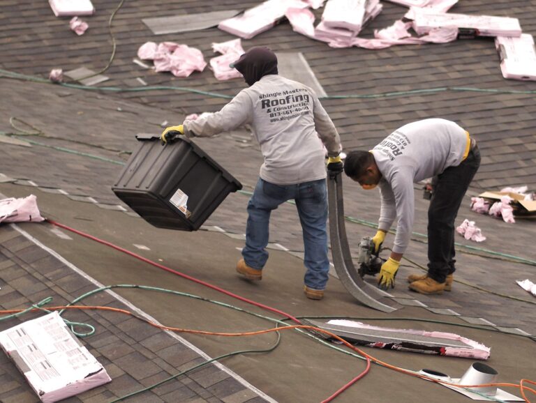 Shingle Masters team working on a roof