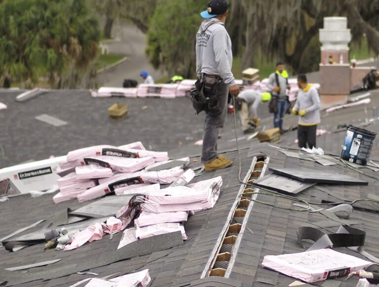 Shingle Masters team working on a roof