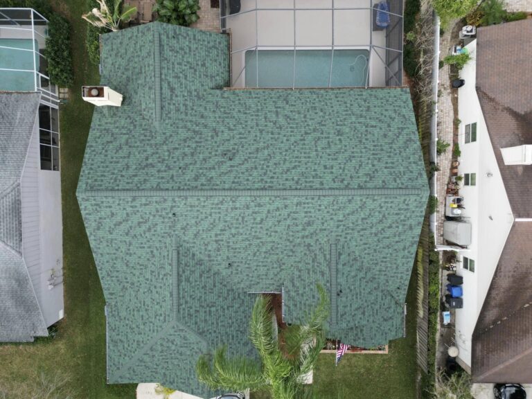 Aerial view of a green shingle roof
