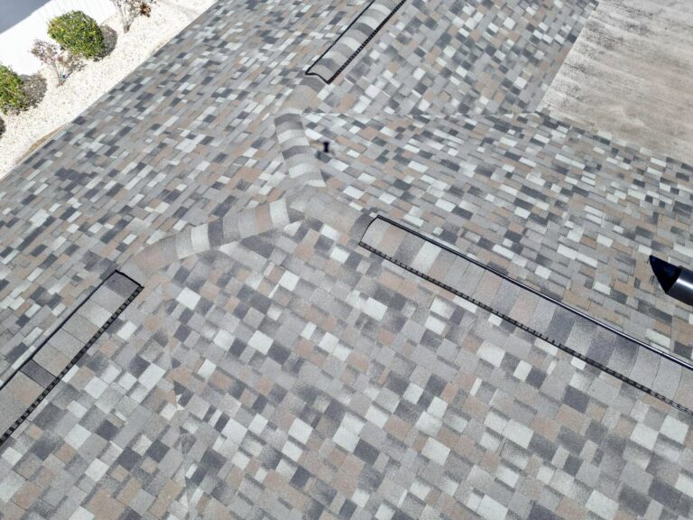 Close-up of a shingle roof with vents
