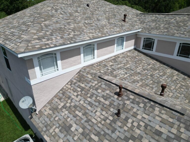 A house with a newly installed shingle roof