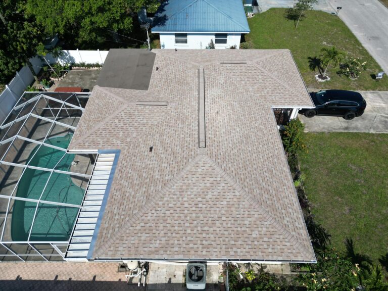 A newly installed tan shingle roof