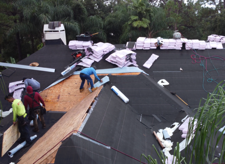 Shingle Masters team working on installing a roof