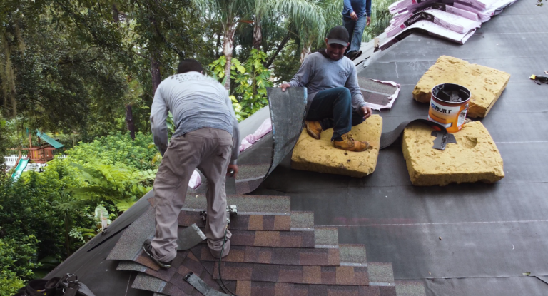 Shingle Masters installing new shingles on a roof