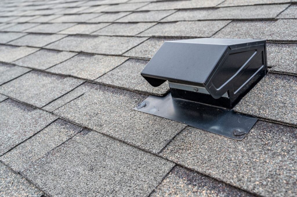 static attic vent on an asphalt shingle roof