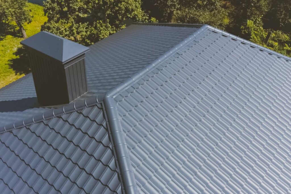 Gray-blue metal roof tiles on the roof of the house